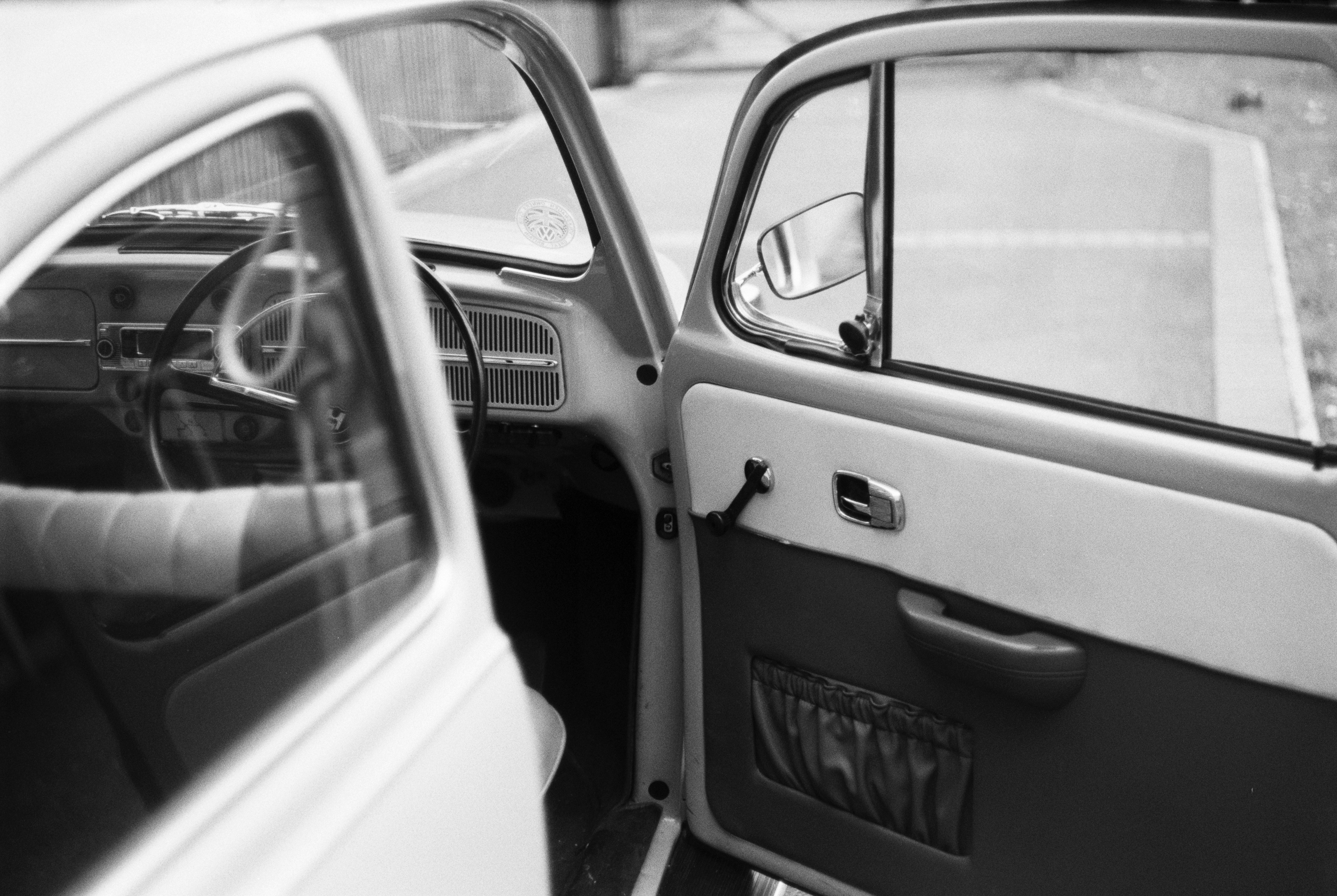 grayscale photo of car door